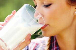 1800ss_thinkstock_rf_woman_drinking_glass_of_milk